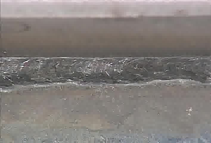 33. Multi-pass fillet weld, T-joint, overhead position (E7018)