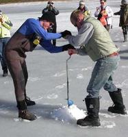 FWR students boring hole in ice in preparation to set gill nets