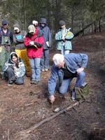 Trapper Jack Lay demonstrating trapping methods