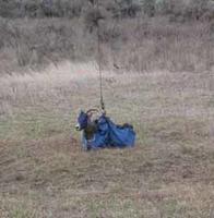 FWR student Colin Bailey setting a Gee or minnow trap